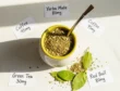 Yerba mate brewed in a traditional gourd with a bombilla straw next to loose leaf tea showing caffeine comparison